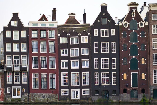 Amsterdam Day Trip from Brussels With Cheese, Clogs and Windmills - Arriving in Amsterdam: the mix of guided sights and self-guided freedom