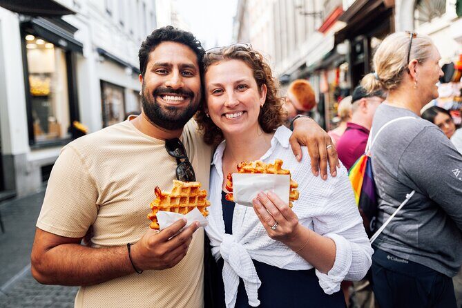 Brussels: Historical Walking Tour with Chocolate & Waffle Tasting - Entering Grand Place and reading the symbols on the facades