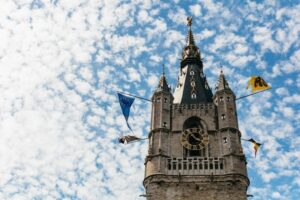 From Brussels: Guided Day Trip to Bruges and Ghent - Bruges: Lake of Love, Begijnhof, and the Belfry on Castle Square